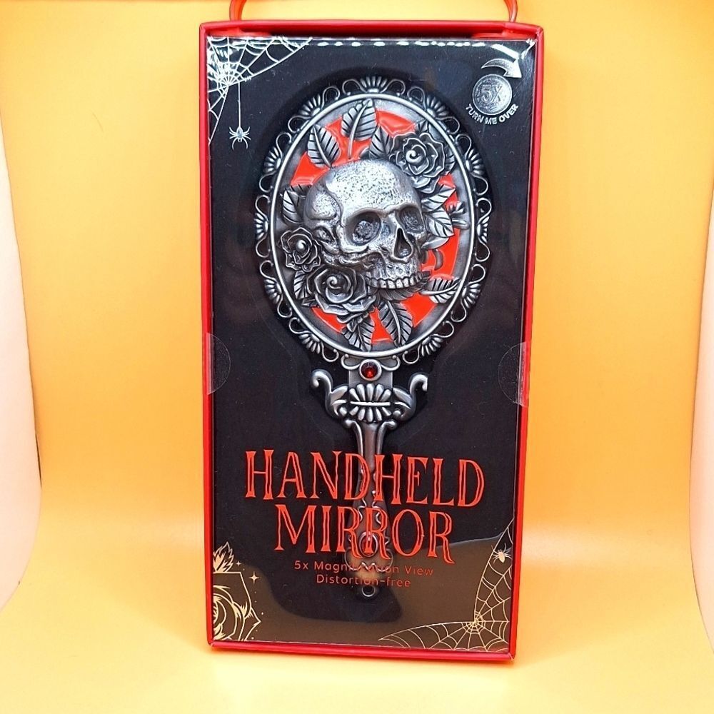 Skull magnifying handheld mirror